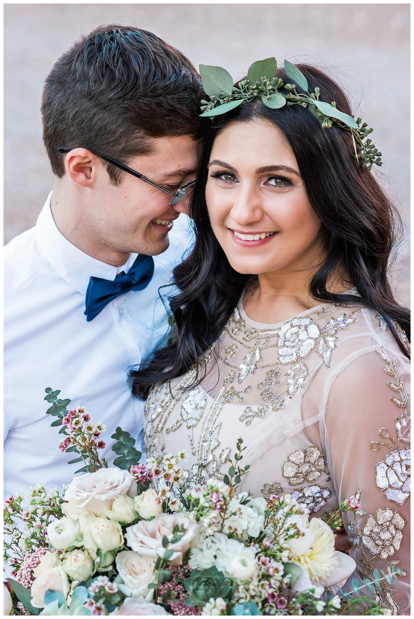 An elegant destination wedding in Vegas, beautiful red rocks, a lovely bouquet, and our couple